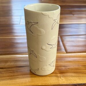 Vase with Birds and Clouds